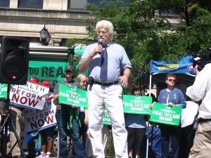 John speaking at rally for health care